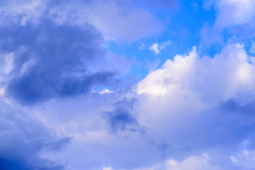 Dramatic puffy clouds isolated against blue skies