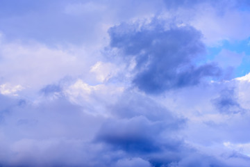 Dramatic puffy clouds isolated against blue skies