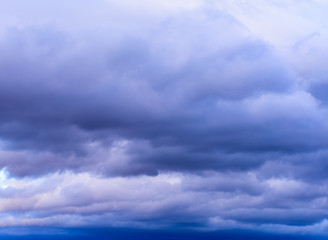 Dramatic puffy clouds isolated against blue skies