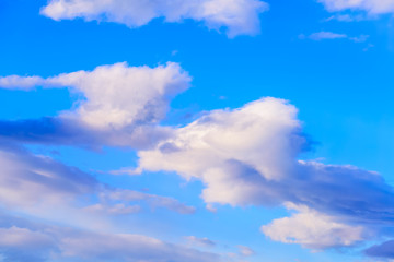 Dramatic puffy clouds isolated against blue skies