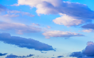 Dramatic puffy clouds isolated against blue skies
