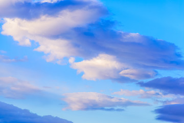 Dramatic puffy clouds isolated against blue skies