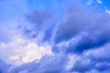 Dramatic puffy clouds isolated against blue skies