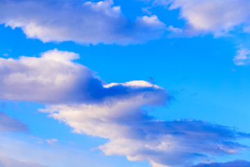 Dramatic puffy clouds isolated against blue skies