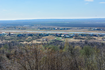 Beautiful view of the fields, meadows, the village and the river Sviyaga. Panorama of the famous Sviyaga river from a high mountain. Ulyanovsk region, Russia.