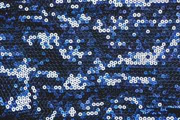 Sparkling blue sequin textile background.