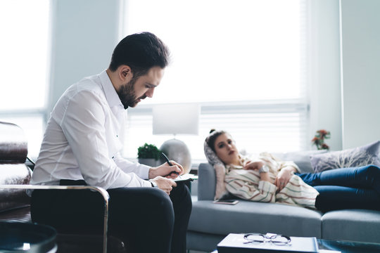 Depressed woman and psychoanalytic in therapy session