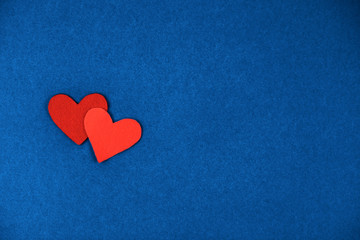 Red and coral felt hearts background for Valentine's Day. Concept of love and St.Valentine's Day.