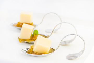 Snacks and canapes on the banquet table, closeup shot on a white background.