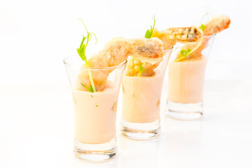 Snacks and canapes on the banquet table, closeup shot on a white background.