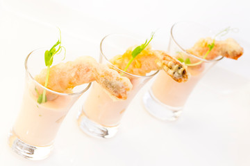 Snacks and canapes on the banquet table, closeup shot on a white background.