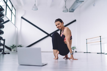 Dancer practicing with laptop in studio