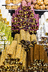 Background sweets baklava turkish delight nuts in the oriental market.