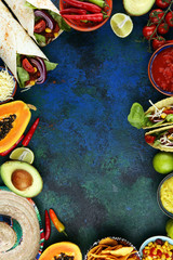 Mexican food mix with nachos copyspace frame colorful background Mexico
