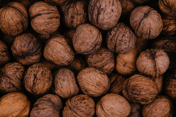 Natural walnut background pattern texture. Abstract walnuts heap pattern background