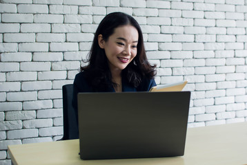 Woman is using laptop for working