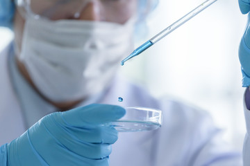 Asian senior scientist male researching and learning in a laboratory.