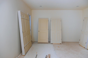 Interior construction of housing project with door and molding installed