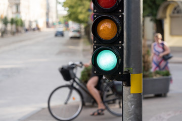 Girl on a bicycle at the traffic light