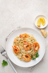  spaghetti pasta with shrimps on white plate