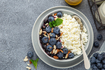 healthy breakfast. Cottage cheese with fresh berry, nuts and honey