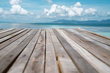 Wooden pier by the beach in tropical country.