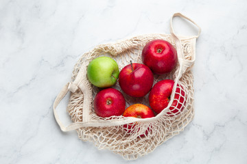 Fresh organic apples in reusable textile shopping  bag. Zero waste and eco-friendly  concept
