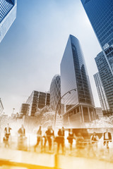 Silhouettes of people walking in the street near skyscrapers and modern office buildings in Paris business district. Multiple exposure image. Economy, finances, business concept illustration.	 - 309970070
