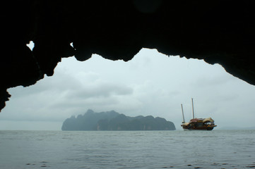 View from the cave to the seascape. From under the arch of the cave you can see the island and the...