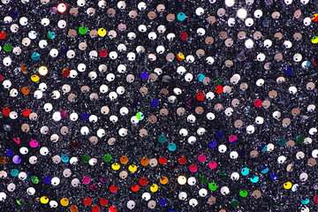 Multicolored sequins textile background.
