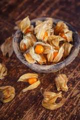 Overhead view of a bowl of dried cape gooseberries (Physalis peruviana)