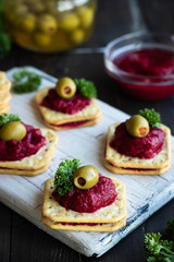 Beetroot relish on crackers. An original party snack.