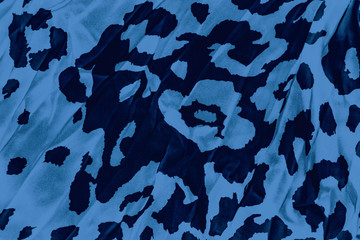 Black and blue background with leopard print, trendy leopard pattern