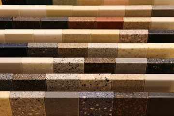 Top view of color samples stone  on oak wood table, Acrylic Solid Surface