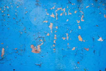 Old peeling paint on the wall closeup