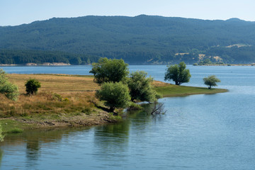 Summer landscape along the road to Camigliatello, Sila. Cecita lake