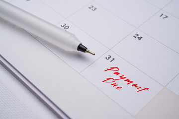 Mortgage payment due on the end of every month. image with pen and calendar 