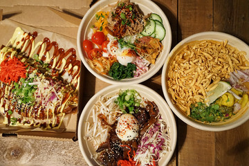 Beef and chicken on rice in Korean style served with Okonomiyaki (Japanese pancakes) and Khao Soi  ,Northern Thai curry noodle soup