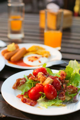 Breakfast for new day and healty food fresh vegetable include orange juice and american breakfast set on the table wood
