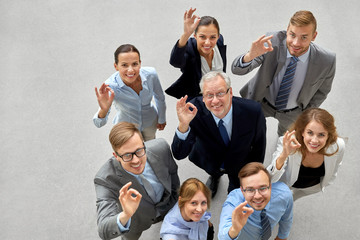 corporate, people and teamwork concept - business team showing ok hand sign at office