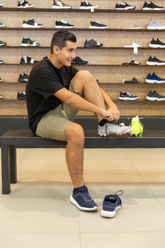 Young man walking in the store