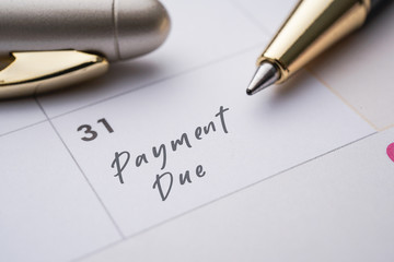 Mortgage payment due on the end of every month. image with pen and calendar 