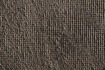 closeup of layers over styrofoam insulation, mesh, plaster, cement, mortar 