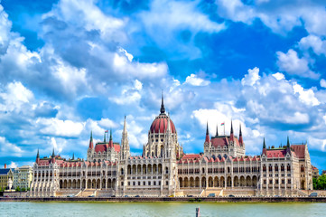 Obraz premium The Hungarian Parliament Building located on the Danube River in Budapest Hungary at sunset.