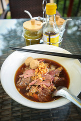 Braised beef noodle soup Thailand cuisine with seasoning background