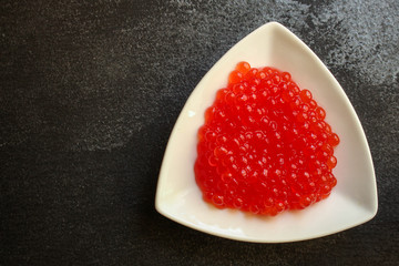 red caviar (seafood, salmon caviar) menu concept. food background. top view. copy space