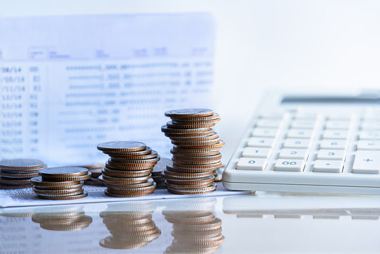 Bank passbook with calculator and stack money coin for growing your business. dividend payment to investors. Money, Financial, Savings money for pension and retirement.