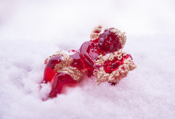 Obraz na płótnie Canvas Christmas toy red angel lying on the snow