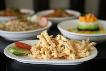fried crispy mushrooms with flour and tomato. Selective focus