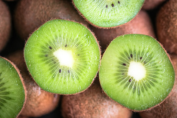Ripe fresh kiwi fruit as background